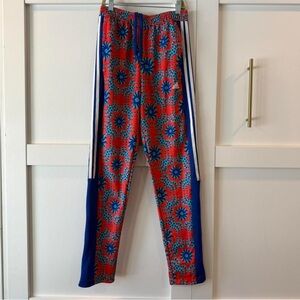Adidas x FARM Rio Tiro track pants a vibrant red and blue kaleidoscopic print XS